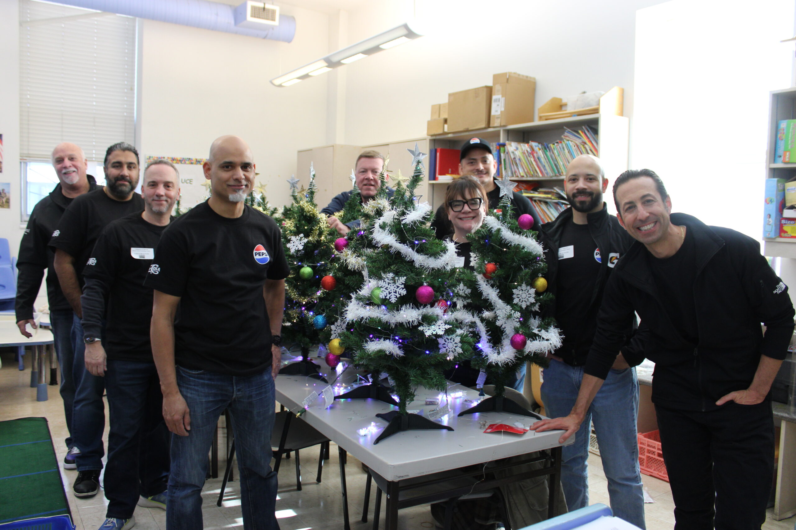 Parents with two kids at a Staten Island FerryHawks Game, part of Honickman's Pepsi NY employee appreciation efforts. 